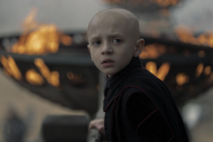 Young child star with a concerned expression in dark clothing, reacting to casting news for Egg in Knight of the Seven Kingdoms.