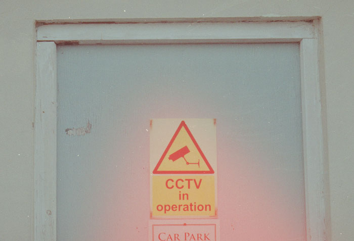 CCTV in operation sign on a door, highlighting security measures against criminals bad at what they do.