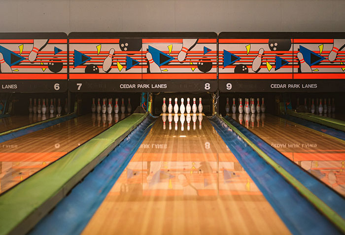 Bowling lanes at Cedar Park Lanes with pins set up, illustrating moments when criminals were shockingly bad at what they do.
