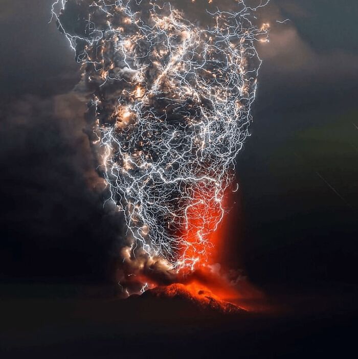 Volcanic eruption with lightning striking through thick smoke, creating a dystopian nightmare scene at night.