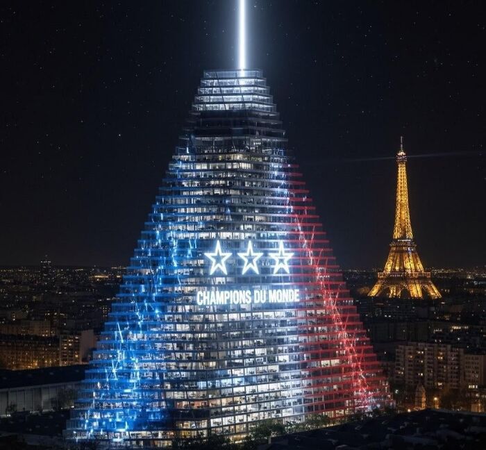 Skyscraper lit in blue, white, and red with Champions du Monde text at night near the illuminated Eiffel Tower dystopian nightmare scene.