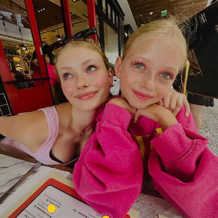 Two teenage girls smiling, capturing a moment related to Eric Dane's recorded heartbreaking last words.