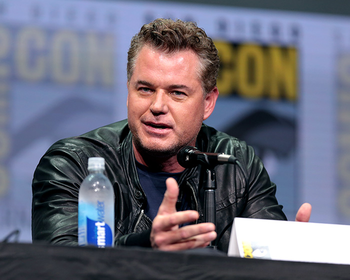 Eric Dane speaking at a panel event, wearing a black leather jacket, discussing his scandalous lifestyle and downward spiral. Eric Dane speaking at a panel event, wearing a black leather jacket, discussing his scandalous lifestyle and downward spiral.