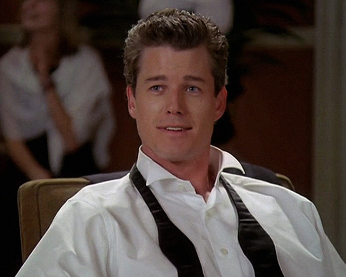 Eric Dane in a white shirt and undone black tie, portraying scandalous lifestyle and downward spiral in a dramatic scene. Eric Dane in a white shirt and undone black tie, portraying scandalous lifestyle and downward spiral in a dramatic scene.
