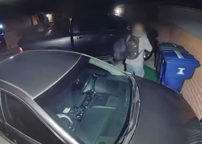 Surveillance image showing a person near parked cars at night linked to Nancy Guthrie kidnapper's pivotal moment investigation.