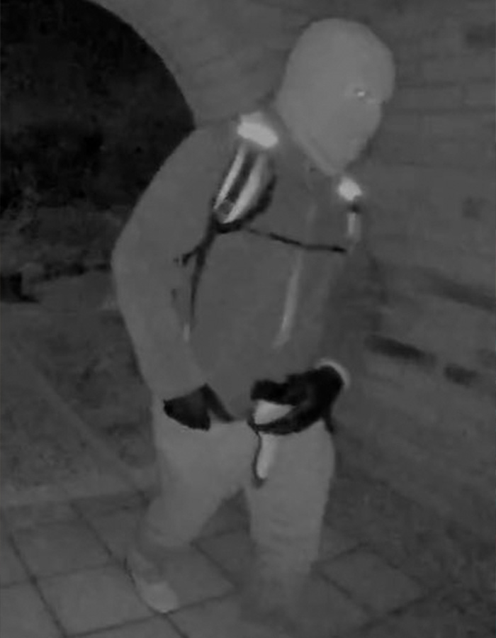 Masked individual dressed in dark clothing captured at night, related to Nancy Guthrie kidnapper&rsquo;s pivotal moment.