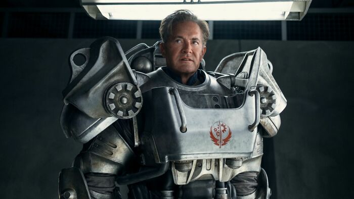 A man in detailed power armor with a red insignia, hinting at Fallout finale’s post-credits scene implications. - 4