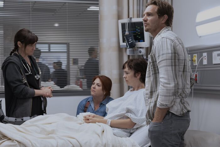 Guest cast of The Pitt Season 2 Episode 6 in a hospital scene with a doctor and concerned visitors discussing patient care. - 2