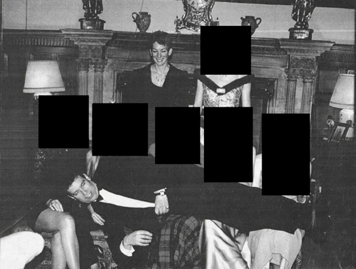 Prince Andrew looking terrified and suffering in first photos after his arrest, surrounded by people in a formal setting.