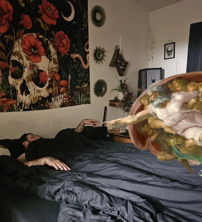 Man lying on bed reaching out awkwardly with body language in a decorated room including skull artwork and surreal elements.