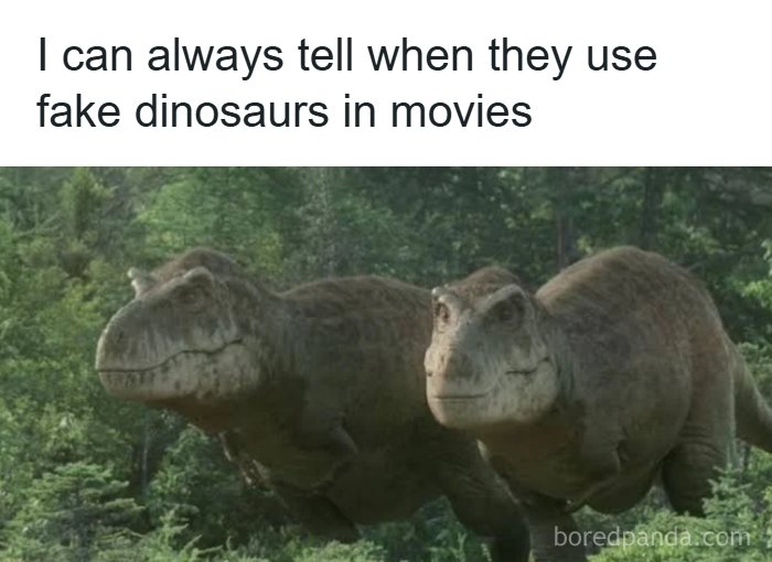 Two fake dinosaurs in a forest scene, illustrating a funny and relatable science fiction meme for nerds.