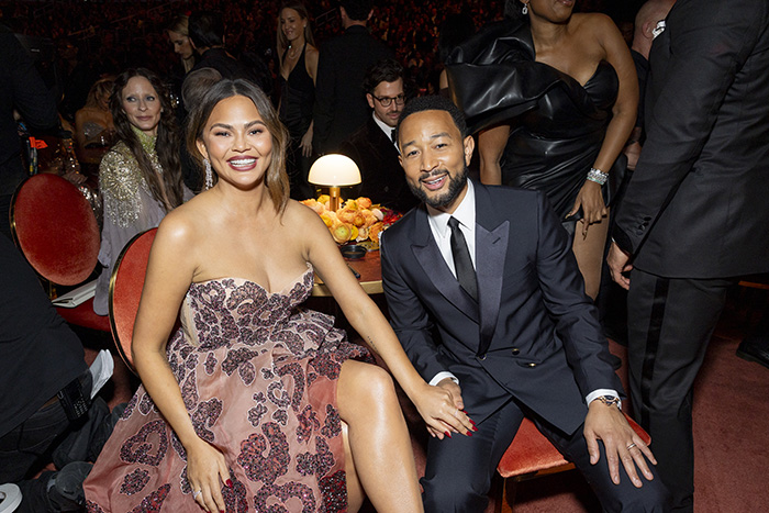 A Grammy seatfiller dressed elegantly at the event, highlighting the strict rules they face during the ceremony.