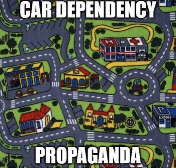 Cartoon map illustrating car dependency propaganda with roads connecting buildings in a small urban layout for funny conspiracy theories.