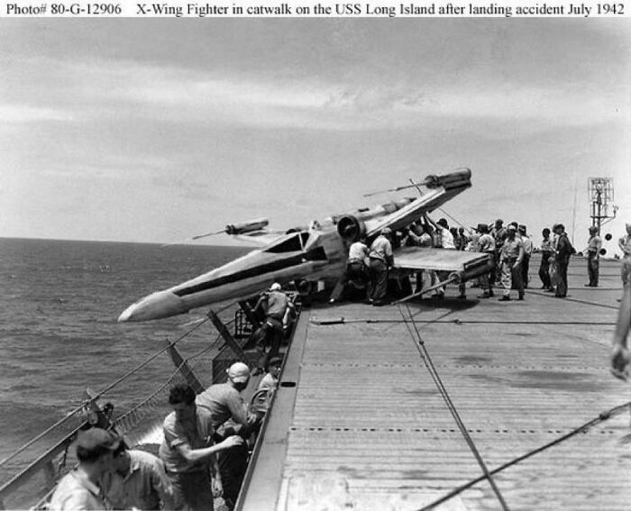 Vintage black and white photo of an unhinged scene with a fictional X-Wing fighter on an aircraft carrier deck.