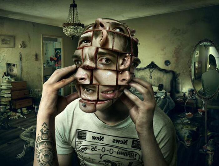 Surreal surreal face split into multiple grid sections in a dark room, illustrating unhinged and wild pics without Photoshop.