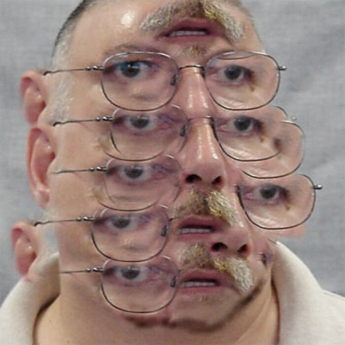 Distorted face with multiple sets of eyes and glasses, creating a wild and unhinged visual effect without Photoshop.
