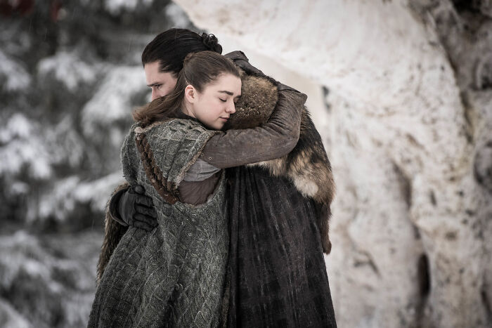 Kit Harington and Sophie Turner embracing in a snowy scene from Game of Thrones, sparking jokes and comments. Kit Harington and Sophie Turner embracing in a snowy scene from Game of Thrones, sparking jokes and comments.