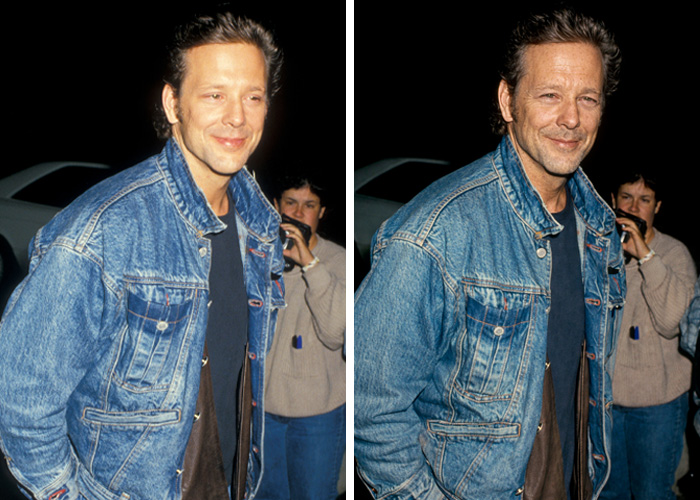 Mickey Rourke smiling and wearing a denim jacket, showing how he would look today without cosmetic procedures.