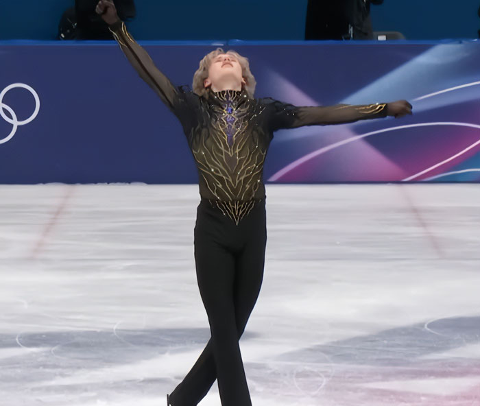 Ilia Malinin performing on ice, drawing concern from fans over troubling posts after major Olympic defeat.