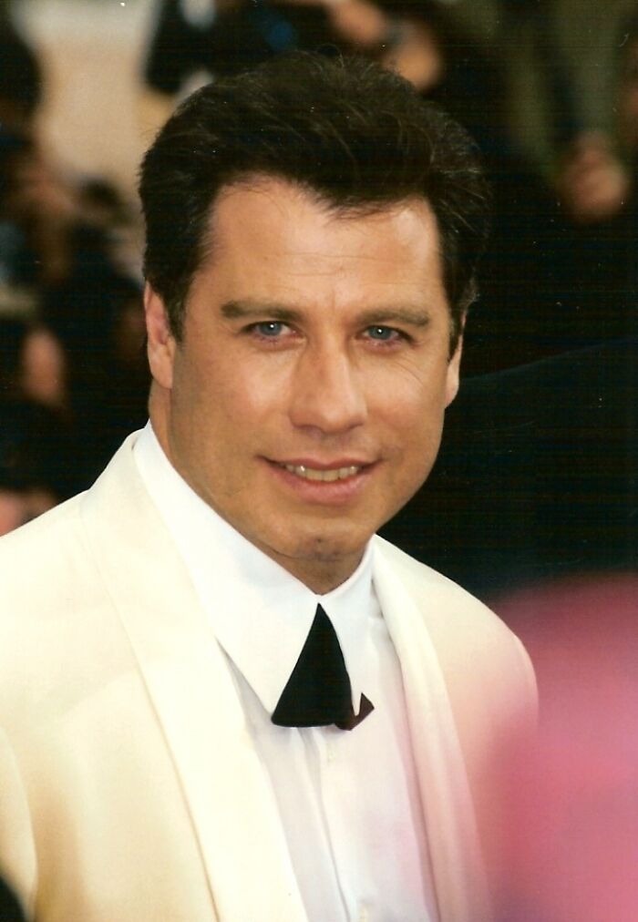 Actor in a white tuxedo at a formal event, featured in a story about celebrities falsely accused of crimes.