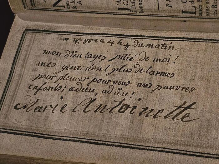 Handwritten note from Marie Antoinette in an antique book, an almost perfectly preserved historical item.