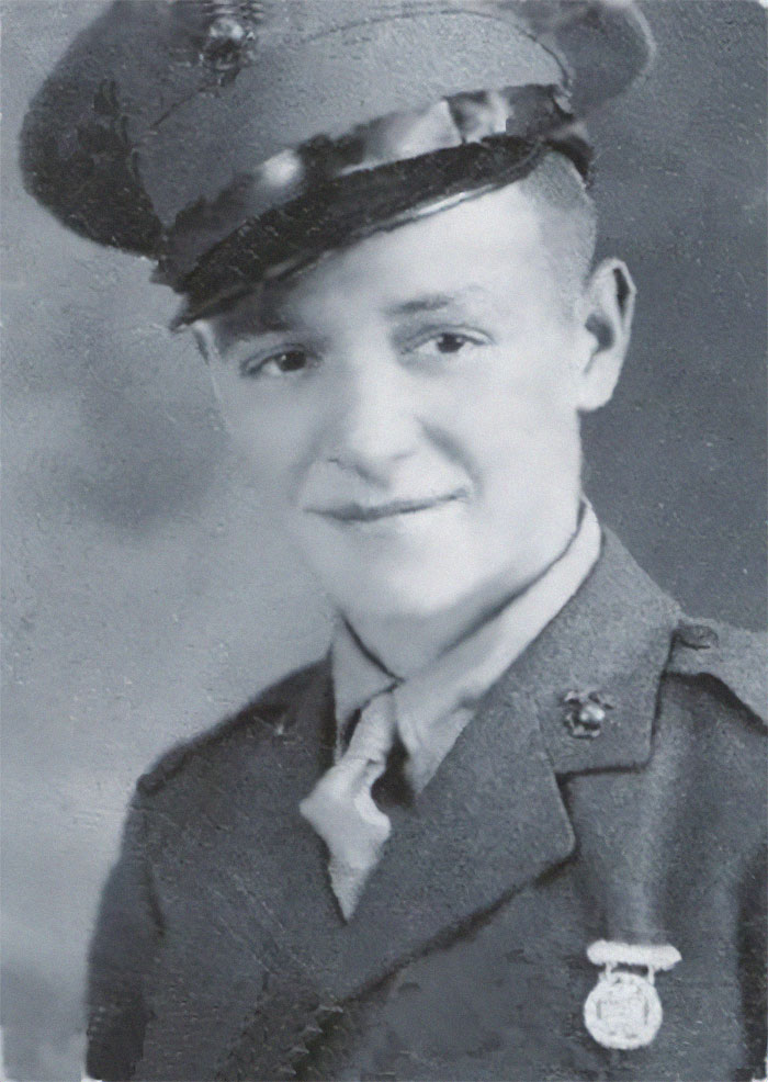 Black and white vintage portrait of a young soldier in uniform, representing history rarely shown in textbooks.