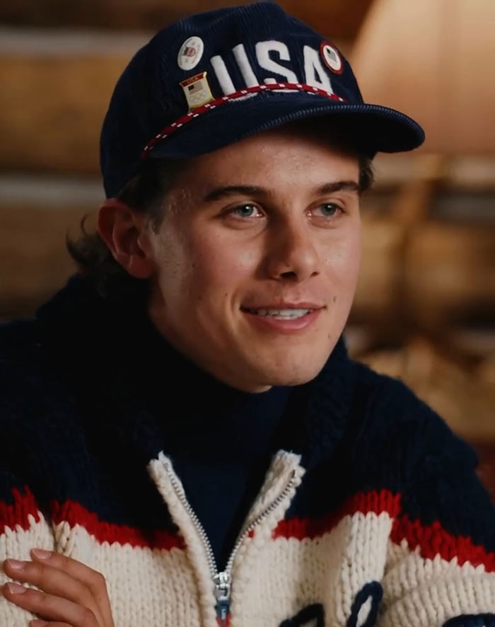 US Olympics hero Jack Hughes wearing a USA hat and sweater, speaking in a casual indoor setting. US Olympics hero Jack Hughes wearing a USA hat and sweater, speaking in a casual indoor setting.