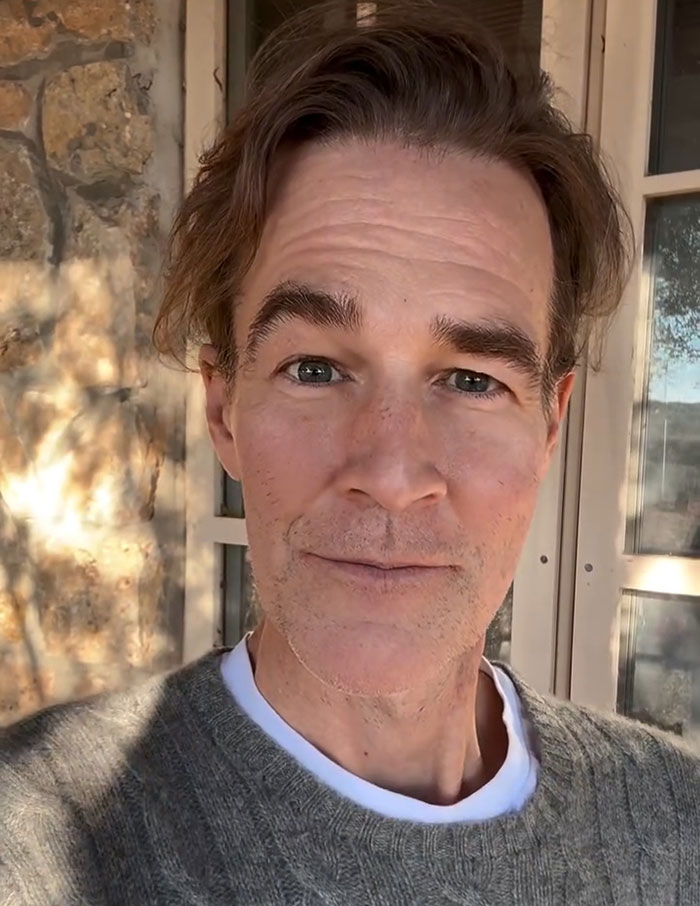James Van Der Beek outdoors in casual wear, captured in a close-up selfie with natural lighting and a neutral expression.