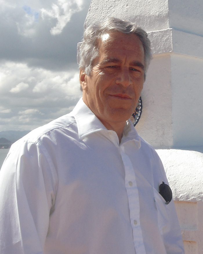 Man in white shirt standing outdoors near white structure under cloudy sky related to Joe Rogan Epstein files news.
