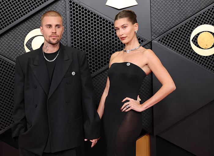Justin and Hailey Bieber at a public event, captured during a tense Super Bowl moment decoded by a lip reader.