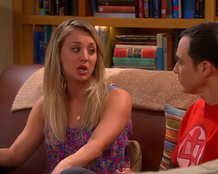 Kaley Cuoco as Penny talking to Sheldon Cooper on the Big Bang Theory set in a living room scene.