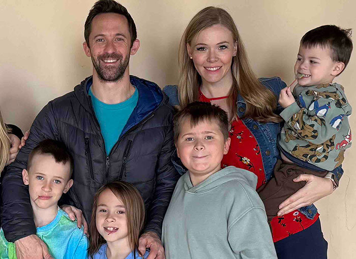 Family reunited after four missing kids returned to dad following foreign orphanage stay post mom's abduction.