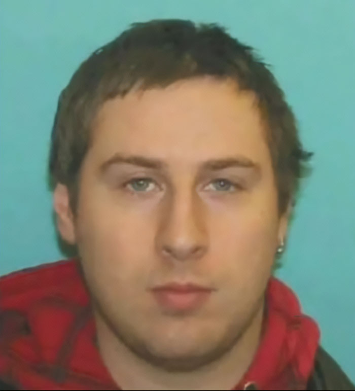Young man with short brown hair wearing a red and black jacket, linked to disturbing criminal history after fatal hockey game attack Young man with short brown hair wearing a red and black jacket, linked to disturbing criminal history after fatal hockey game attack