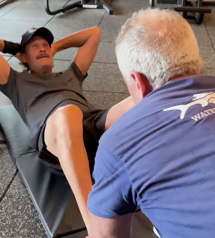 RFK Jr. and Kid Rock performing a workout exercise together on a gym floor, sparking wild reactions. RFK Jr. and Kid Rock performing a workout exercise together on a gym floor, sparking wild reactions.