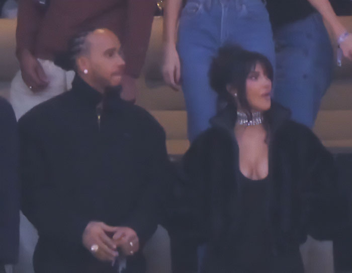 Lewis Hamilton and Kim Kardashian showing tightly controlled body language in a public setting, analyzed by expert.