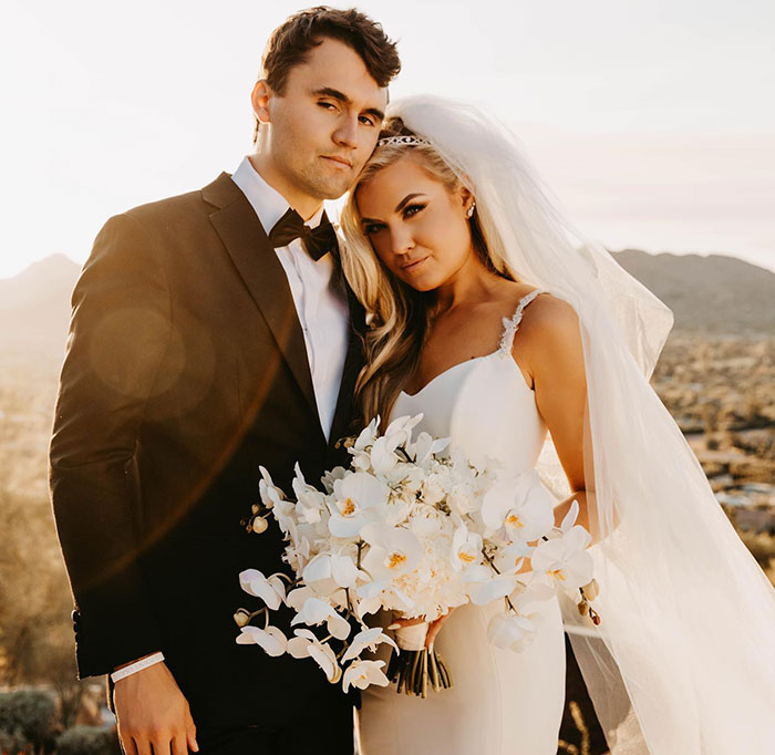 Erika Kirk and Charlie posing outdoors in wedding attire, highlighting changes in Charlie's office seen by fans.