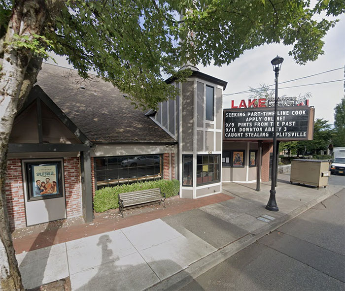 Exterior view of a small theater with a marquee about a part-time cook and showing the movie Splitsville.