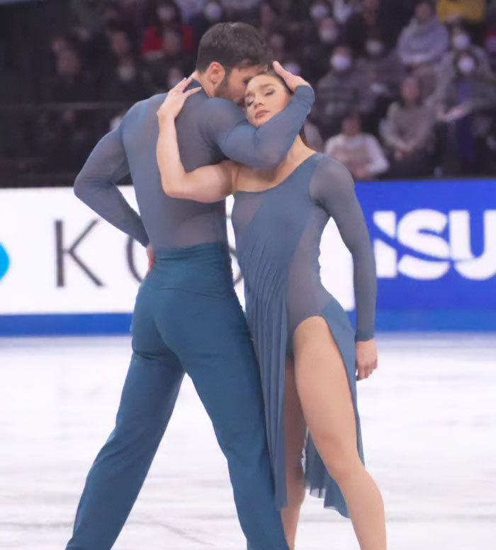 French skater and partner perform an elegant ice dance routine amid Olympics cheating scandal controversy.