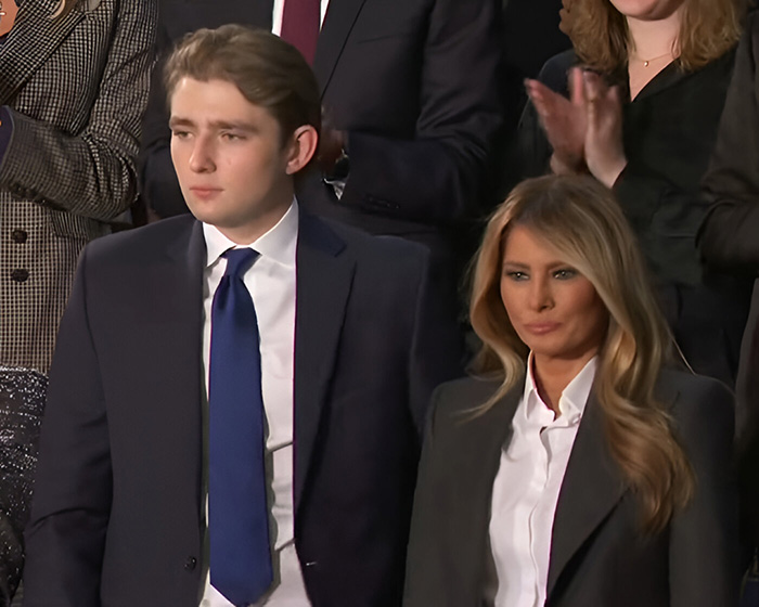 Barron Trump and Melania Trump attending an event together with serious expressions, lip reader claim about rude words.
