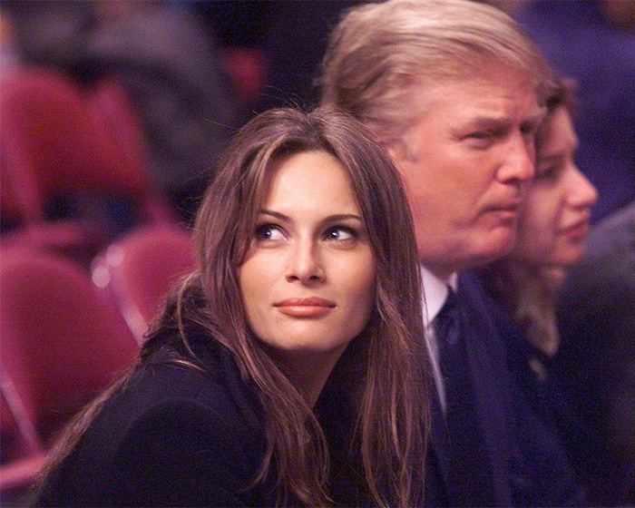 Melania and Donald Trump seated at an event, highlighting Melania revealing what she said about the age gap.