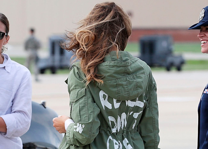 Melania Trump’s polished appearance disrupted as wind blows hair and jacket, revealing an unexpected hidden detail outdoors.