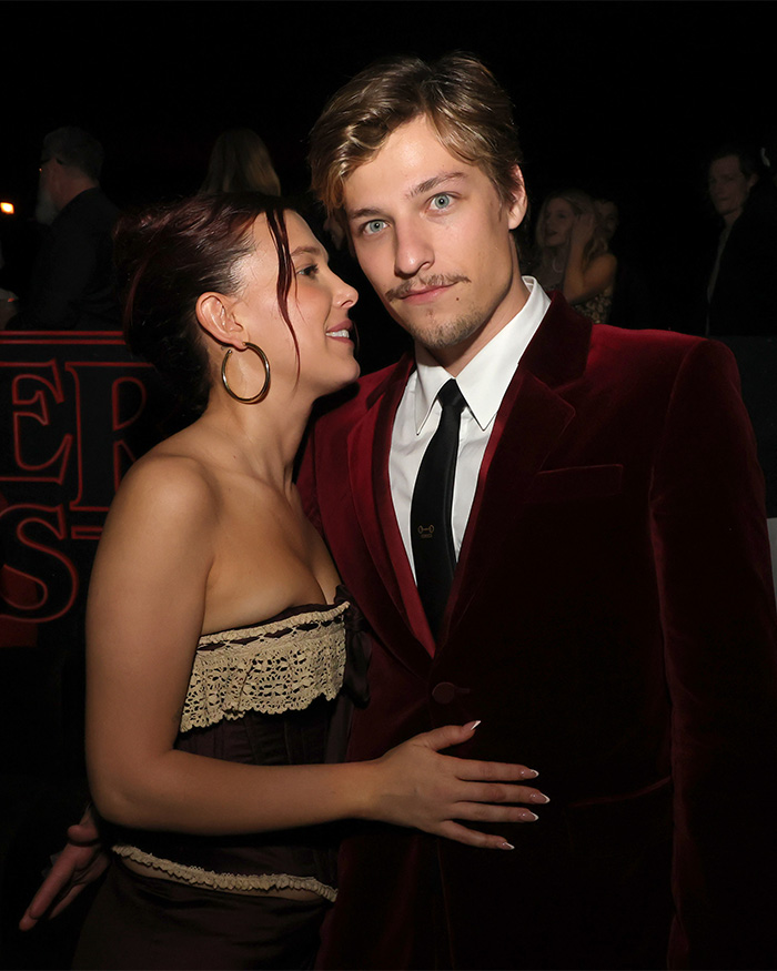 Millie Bobby Brown with partner in elegant outfits at night event before sharing photo of her baby daughter