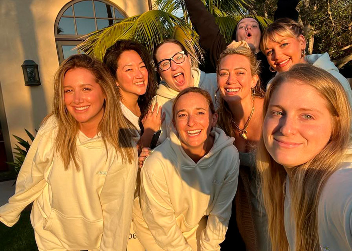 Group of women smiling outdoors in natural light, unrelated to Toxic Mom drama or Kaley Cuoco&rsquo;s attack on Ashley Tisdale