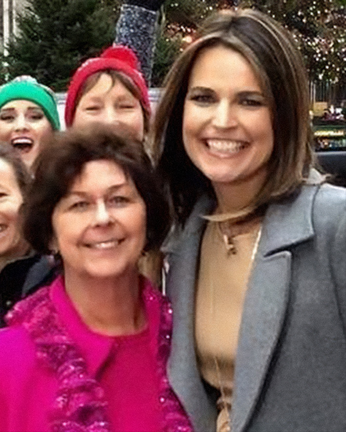 Group photo showing Nancy Guthrie and several smiling women outdoors, related to FBI suspect images released morning disappearance.