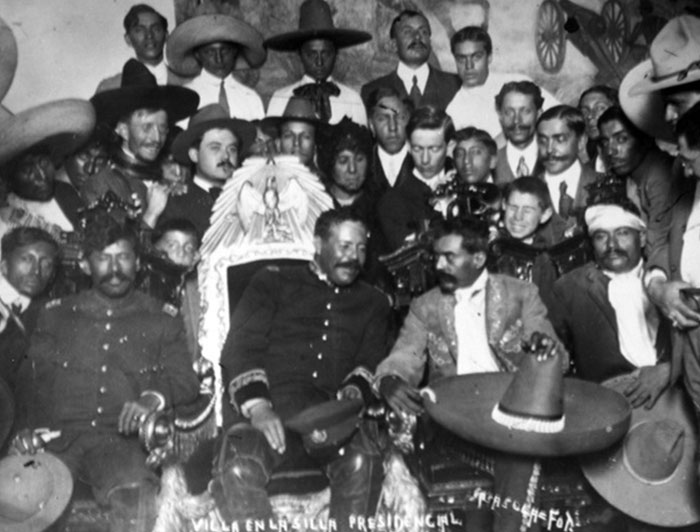 Historic group photo featuring diverse men in traditional and military attire, a powerful photo from all over the world.