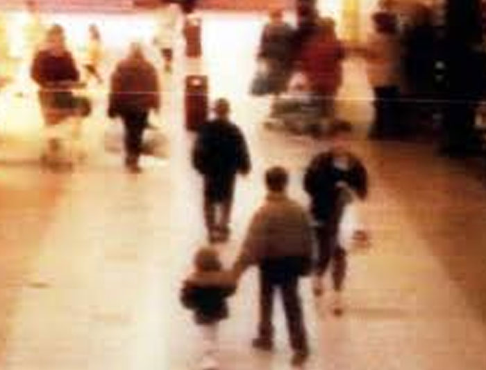 Blurry photo of people walking indoors in a busy space, capturing powerful photos from all over the world.