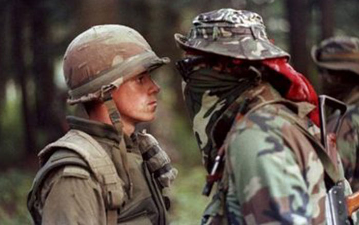 Two soldiers face each other closely in a tense moment, capturing a powerful photo from conflict zones worldwide.