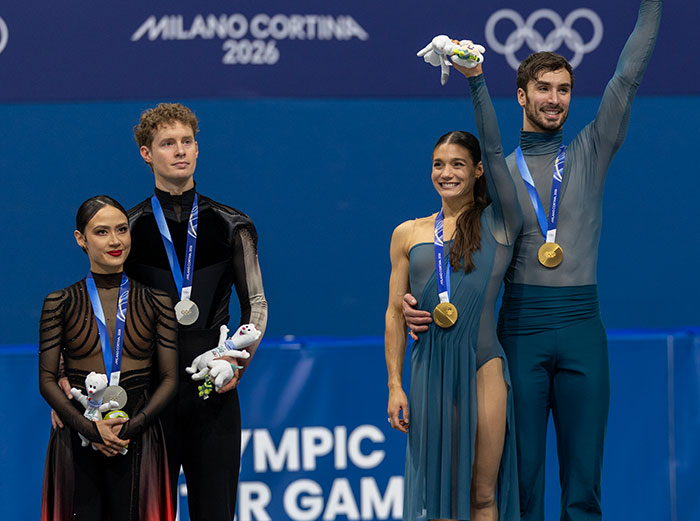 French ice skaters on the Olympic podium amid heated cheating scandal drawing public fury and controversy.
