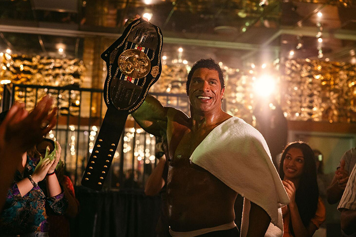 Actor celebrating with championship belt in scene from Oscar nominated movies 2026, showcasing winning moments.