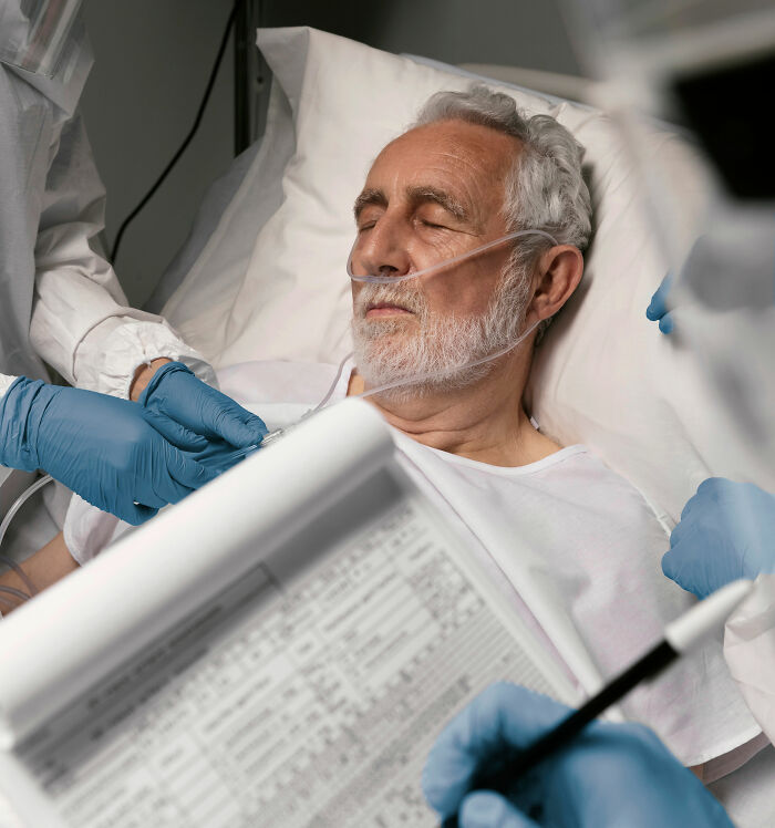 Elderly man in hospital bed receiving care, illustrating uncomfortable and messy secrets confessed anonymously.